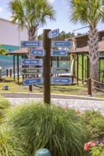 Sign directs guests to different attractions at Ocean Adventures Marine Park in Gulfport,