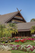 Ornate trees and lush flower gardens enhance the Lanna and Swiss architecture of the Doi Tung Royal