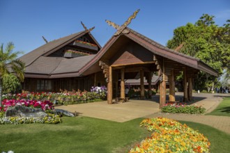 Ornate trees and lush flower gardens enhance the Lanna and Swiss architecture of the Doi Tung Royal