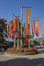 Lanna flags display celebrates cultural history inside the Doi Tung tourist attraction in Chiang