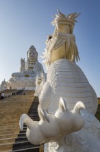Chinese dragons line the steps up to the Guan Yin (Goddess of Mercy) statue at Wat Huay Pla Kang