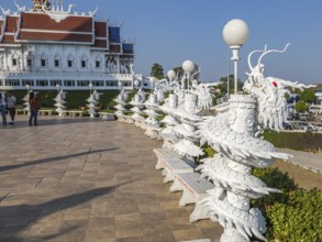 Ornate dragon sculptures around the perimeter of the Guan Yin (Goddess of Mercy) statue at Wat Huay