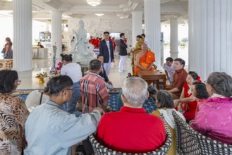 Visitors with monk at the Guan Yin (Goddess of Mercy) statue at Wat Huay Pla Kang Temple in Chiang