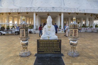 Buddhist shrine at the base of the Guan Yin (Goddess of Mercy) statue at Wat Huay Pla Kang Temple
