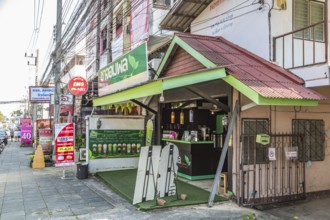Flavored drink shop open to the sidewalk in Chiang Rai province of Northern Thailand
