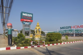 Buddahist shrine outside of the Mega Home building materials warehouse store in Chiang Rai province