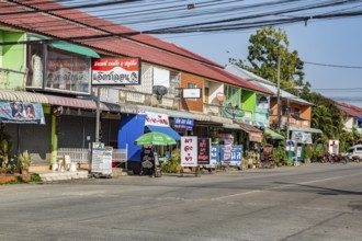 Retail businesses along street in Chiang Rai, Thailand