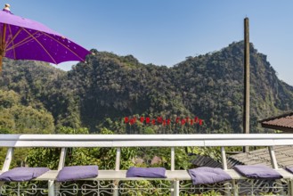Sign on outdoor bench at the Doi Phamee coffee shop and restaurant, in Mae Sai district of Chiang