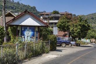 Photo of recent kink in shrine near the entrance to Doi Pha Mee in the hills of the Mae Sai
