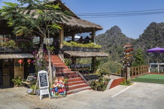 Stairs lead up to the dining area and down to the gardens at the Doi Phamee coffee shop and