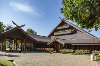 Ornate trees and lush flower gardens enhance the Lanna and Swiss architecture of the Doi Tung Royal