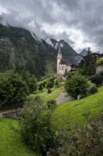 Parish church of St Vincent in Heiligenblut, cloudy mountain landscape, courtyard, Heiligenblut am