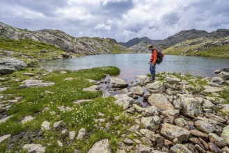 Mountaineer at a mountain lake in high mountain landscape at the Upper Senner Egete, Seven Lakes