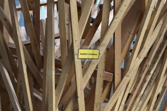 No climbing - sign in an outdoor exhibition at the Futurium on the subject of agriculture and