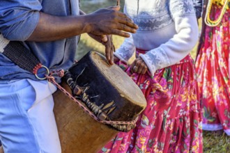 Rustic atabaque of African origin played in a presentation of Brazilian popular culture