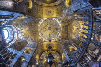Wide angle view of the richly decorated ceiling of st. Mark's basilica, showcasing its intricate