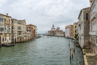 Scenic view of the grand canal flowing through venice, showcasing colorful historic buildings and