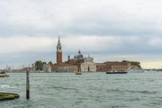 Scenic view featuring san giorgio maggiore church and its iconic bell tower, with boats sailing