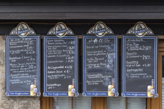 Food offers written on blackboards in front of a restaurant, Bavaria, Germany