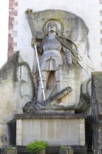 St George the Dragon Slayer with dragon on the exterior façade of St Martin's Church in Endingen am