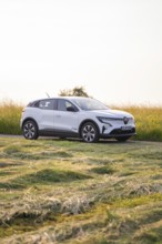 White car on a rural road in Sommerfeld, Renault Megane, Deer E Carsharing, electric car, Calw,