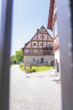 Traditional half-timbered building on a sunny day with blue sky, event and wedding location Lorch