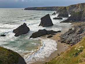 Dramatic coastal landscape with rocks and waves on the beach, Bedruthan Steps, Newquay, Cornwall,
