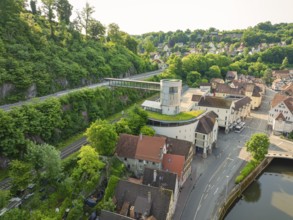 Modern building with a view of an idyllic old town and green hills, Calw, Black Forest, Germany