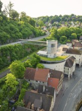A modern structure with a green roof above a historic urban landscape, Calw, Black Forest, Germany