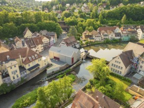 Idyllic town with river in front of a wooded hill with half-timbered architecture, Calw, Black