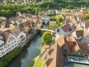 Aerial view of a neighbourhood with river and half-timbered houses under a clear sky, Calw, Black