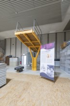 Industrial steel construction with railings and information poster, historical art exhibition in