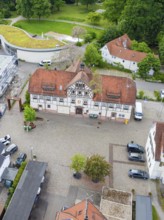 Central view of half-timbered structure with cobblestones and green surroundings, Hirsau, Calw,