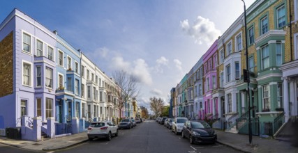 Traditional colorful terraced houses lining a street in notting hill, a popular neighborhood in