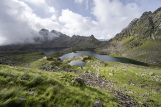 Mountain landscape with mountain lakes Wangenitzsee and Kreuzsee, cloudy mountain peaks in the
