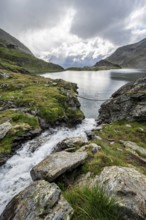 Suspension bridge over a mountain stream at the Wangenitzsee mountain lake, Schober Group, Hohe