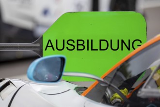 (Photomontage) Training Symbol image: Lollipop in motorsport with modified text TRAINING