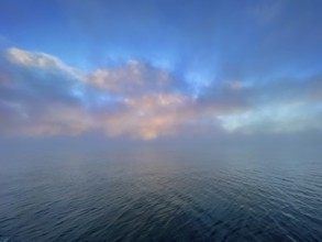 Fog and clouds over Lake Starnberg, Bavaria, Germany