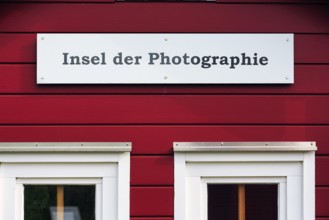 Red lobster shack, sign with inscription, Insel der Photographie, facade detail, Museum Helgoland,