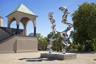 Stainless steel sculpture entitled Points of View by Tony Cragg in front of the exhibition