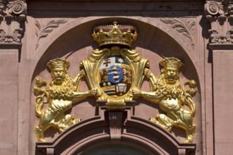 Lion-emblazoned coat of arms on the main portal of the new building by Louis Rémy de la Fosse,