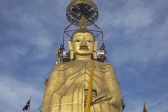 32 metre high standing Buddha decorated with glass mosaics and 24 carat gold, the upper knot of the