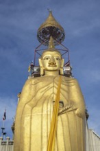 32 metre high standing Buddha decorated with glass mosaics and 24 carat gold, the upper knot of the