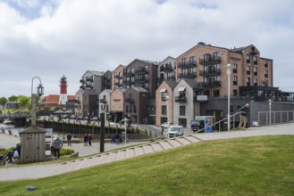 Hotel and apartment building, lighthouse, Am Hafen, Büsum, North Sea, Schleswig-Holstein, Germany