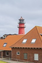 Lighthouse, houses in the foreground, Büsum, North Sea, Schleswig-Holstein, Germany
