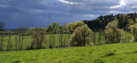 Rain clouds in a spring landscape, Franconia, Bavaria, Germany