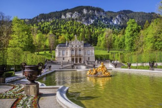 Water parterre with flora fountain and the portal of Linderhof Castle in spring, municipality of
