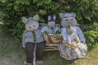 Rabbit family on a bench, Easter decoration in a village in Upper Franconia, Bavaria, Germany