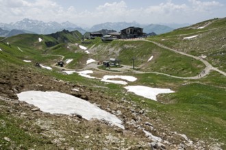 Edmund-Probst-Haus and Höfatsblick mountain station of the Nebelhornbahn, behind mountains of the