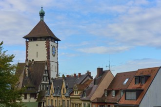 Schwabentor and half-timbered houses under a blue sky, Freiburg im Breisgau, Black Forest,